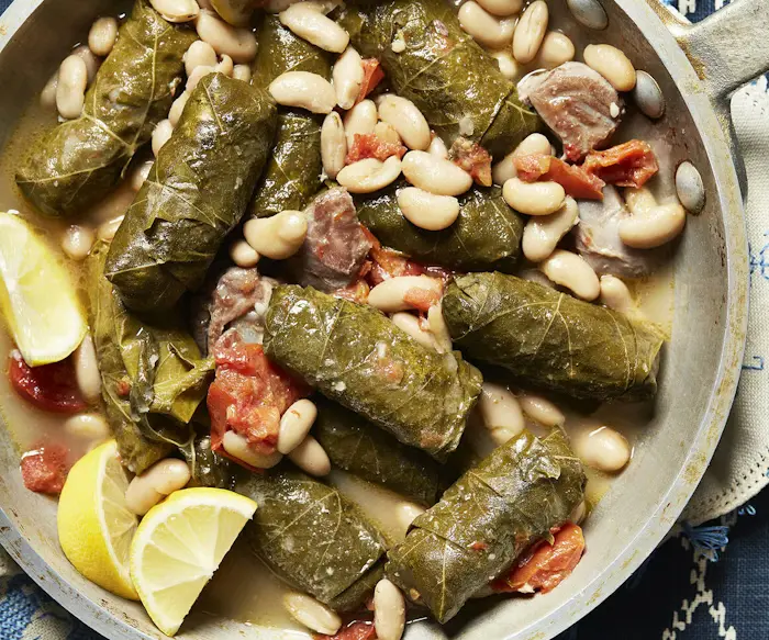 Yaprakes De Oja De Parra Kon Avas (Stuffed Grape Leaves Stewed With White Beans) image