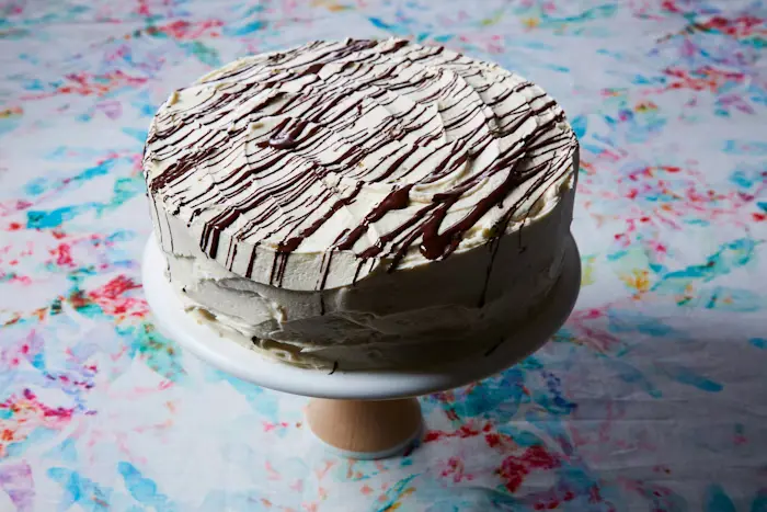 Chocolate Cake With Vanilla Icing and Bitter Chocolate Drizzle image